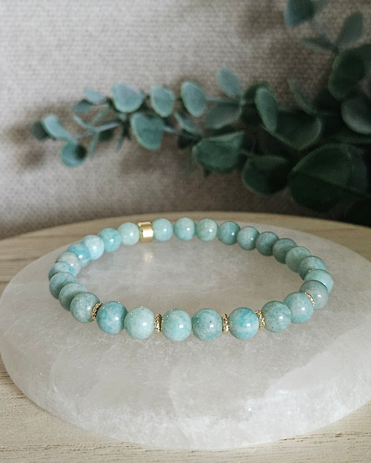 Amazonite Grace bracelet with blue-green gemstone beads and 14k gold-plated accents displayed on selenite