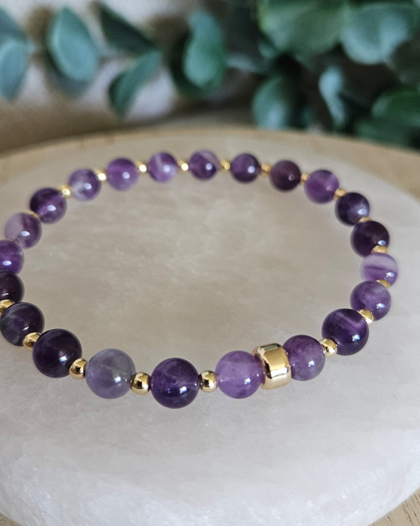 Close-up of the natural Amethyst beads, polished gold-plated spacers and focal accent