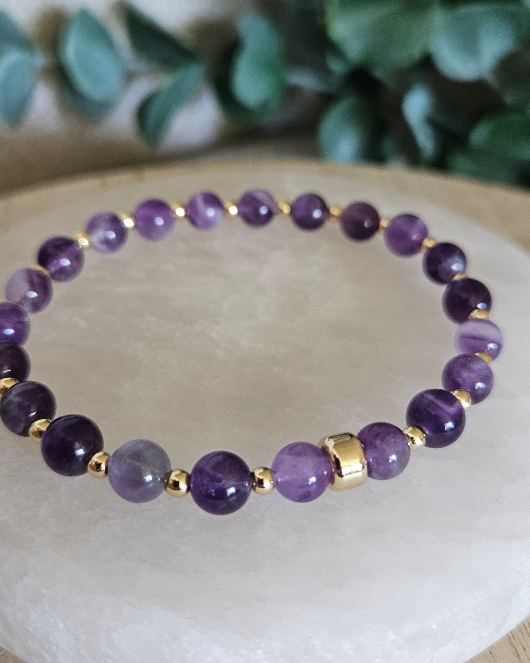 Close-up of the natural Amethyst beads, polished gold-plated spacers and focal accent