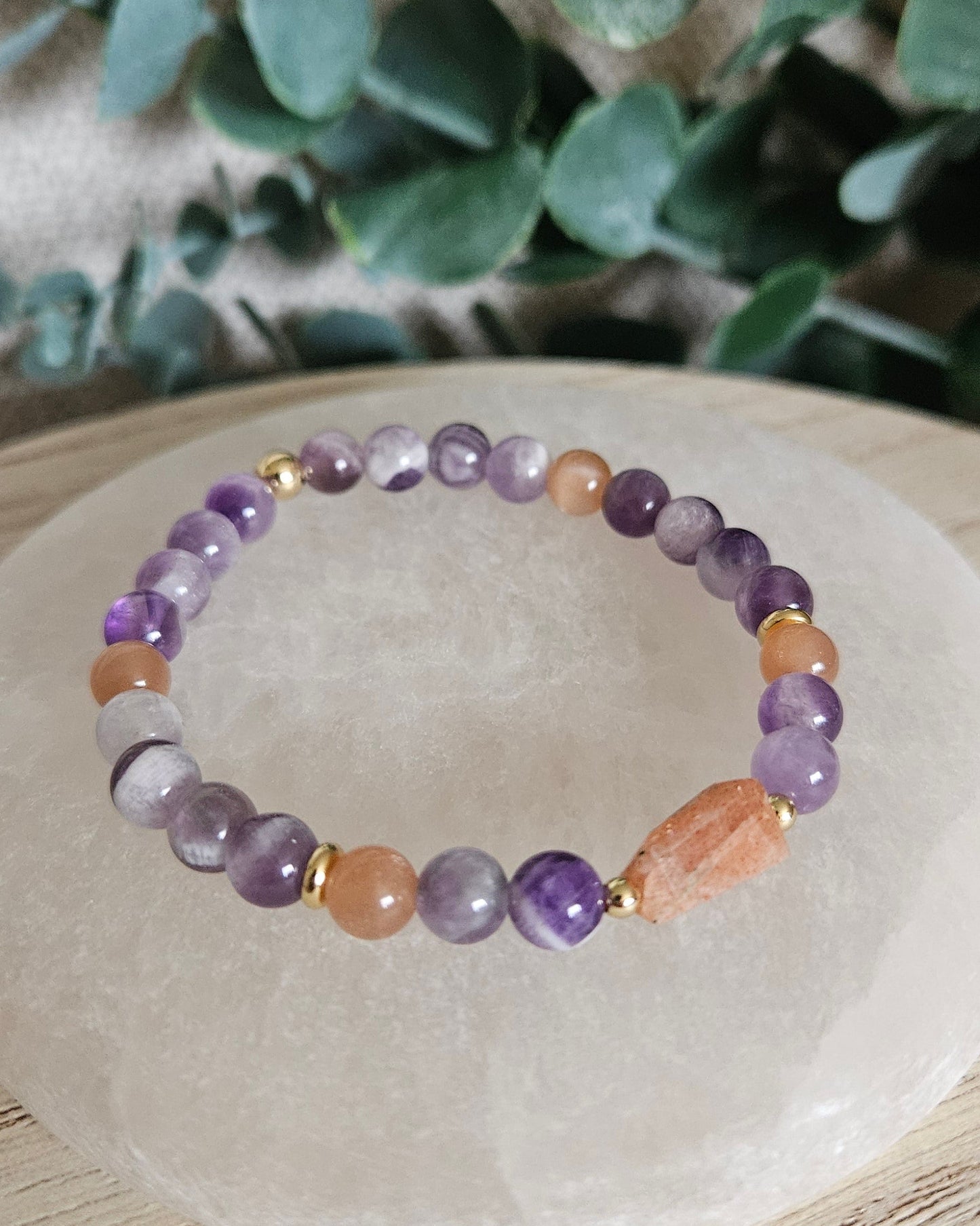 Close-up of the purple Amethyst beads, peach Sunstone accents and elongated Sunstone focal