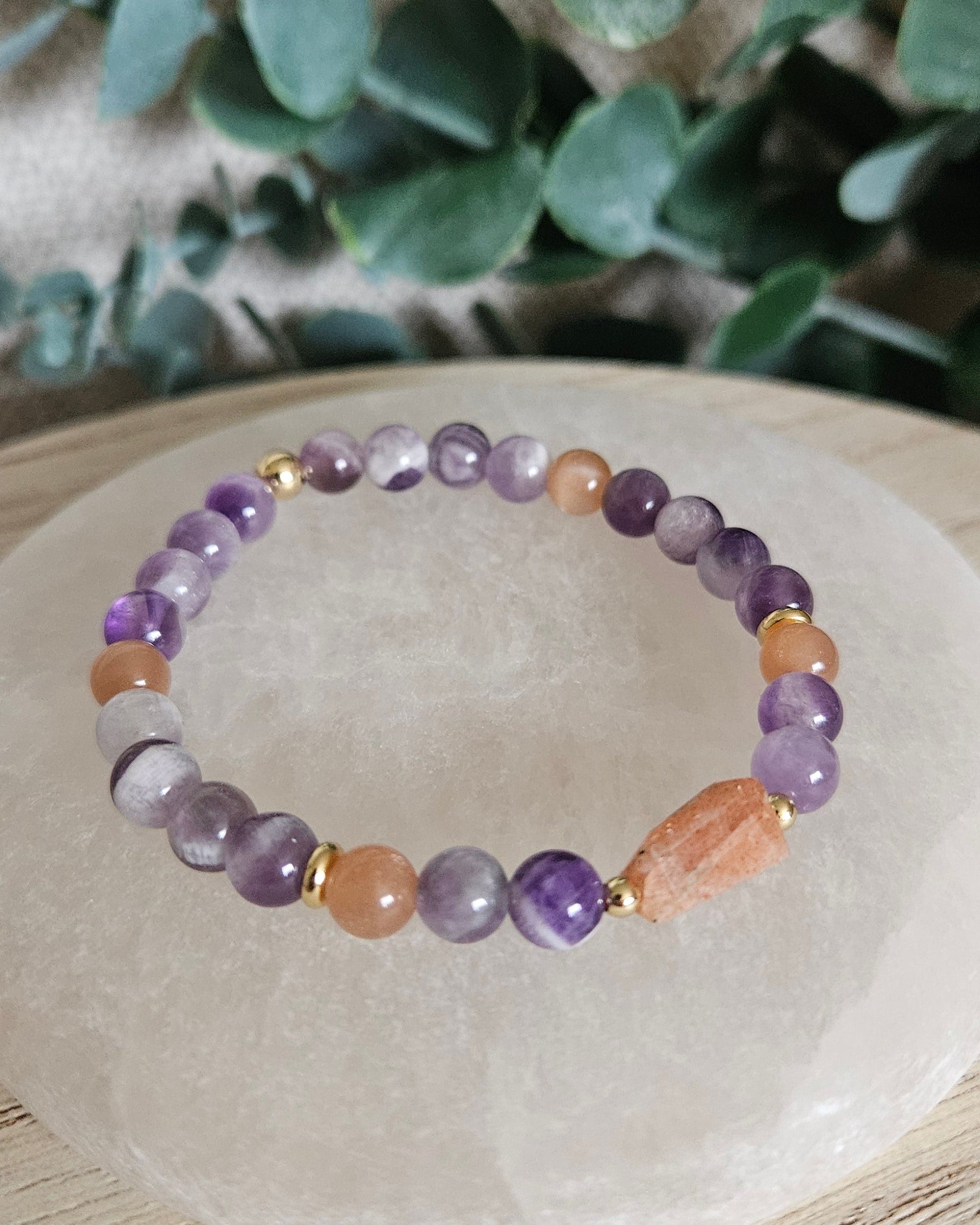 Close-up of the purple Amethyst beads, peach Sunstone accents and elongated Sunstone focal