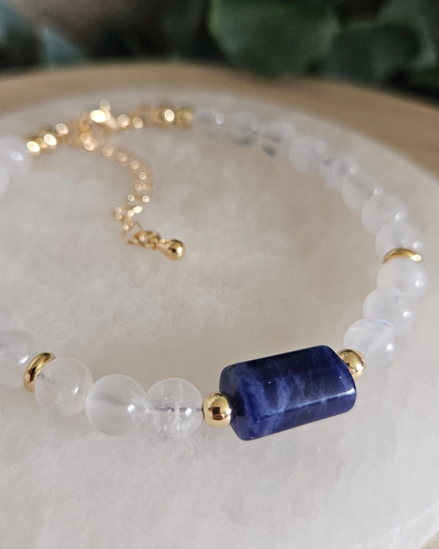 Close-up of the polished Sodalite focal, translucent Moonstone beads and gold-plated accents