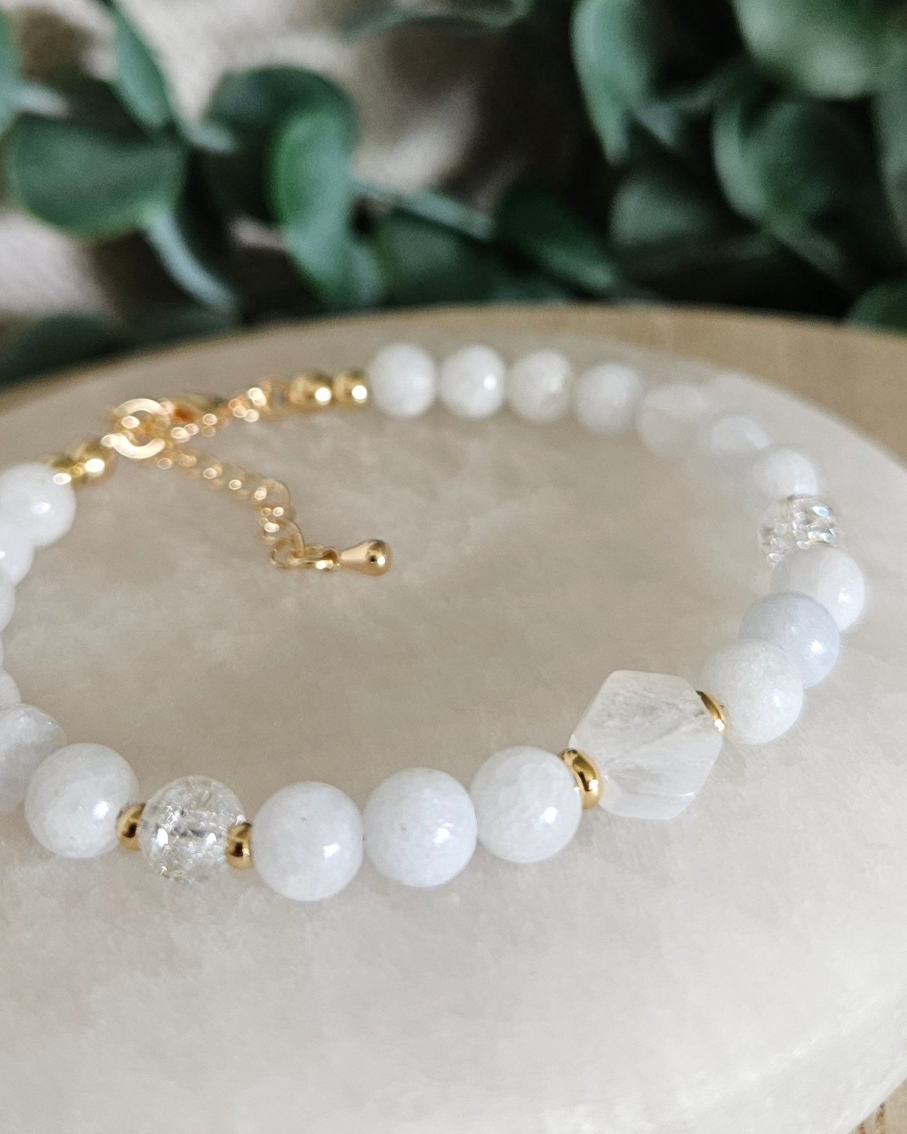 Close-up of the hexagon-cut Moonstone focal, Celestite beads, Cracked Quartz accents and gold details