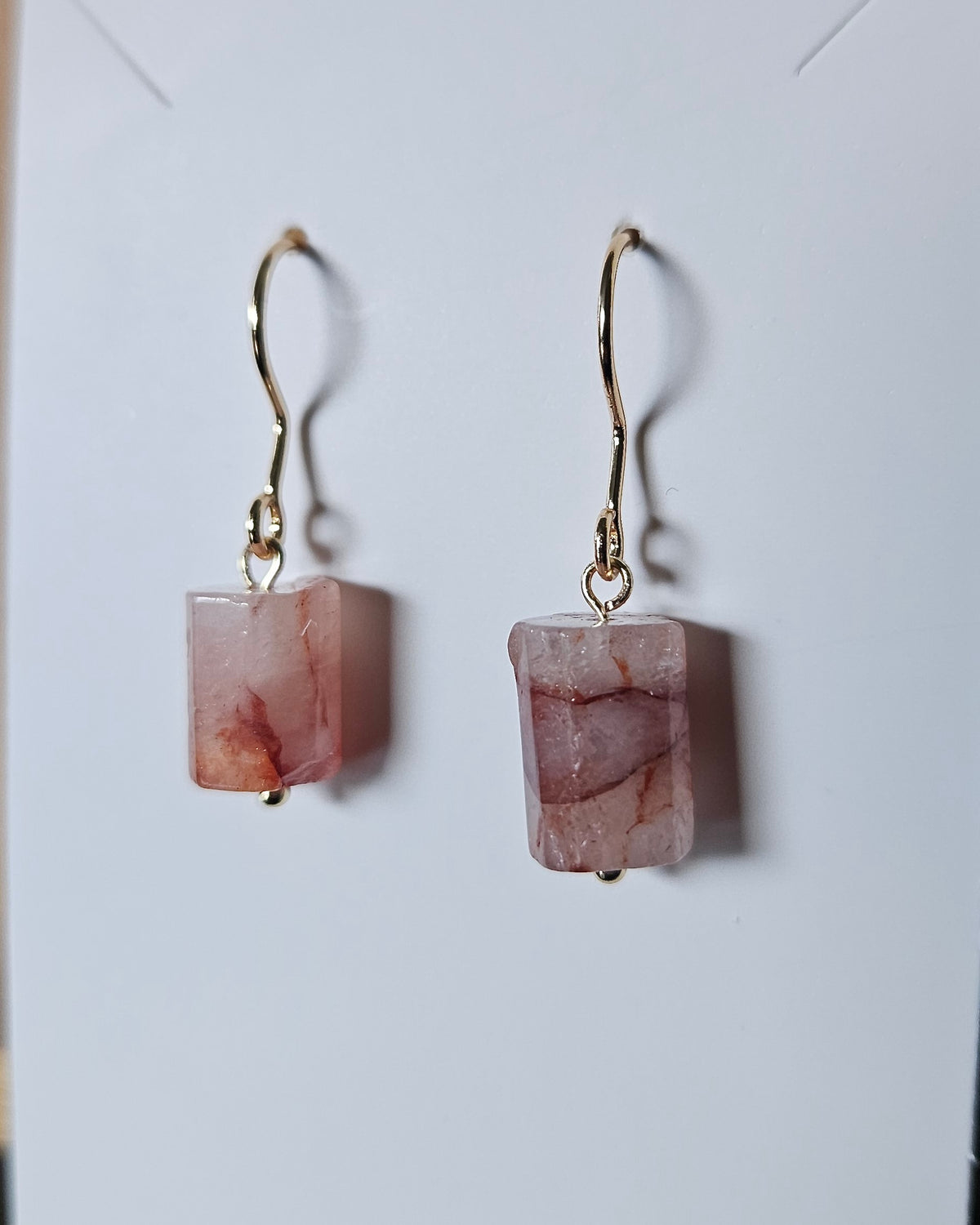Close-up of red hematoid quartz drop earrings with 14k gold-plated stainless steel findings