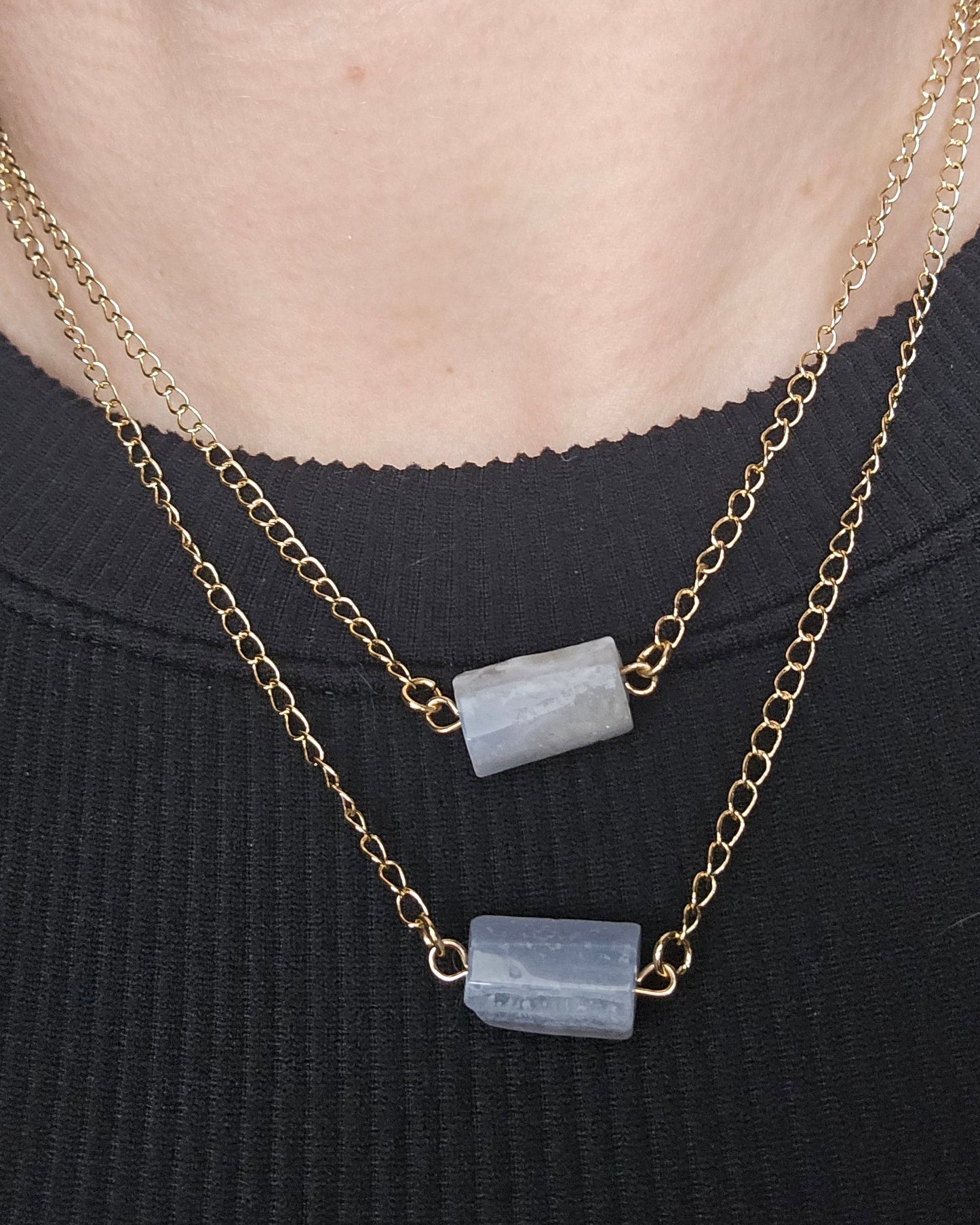 Close-up of the Blue Lace Agate double-chain necklace worn over a black top
