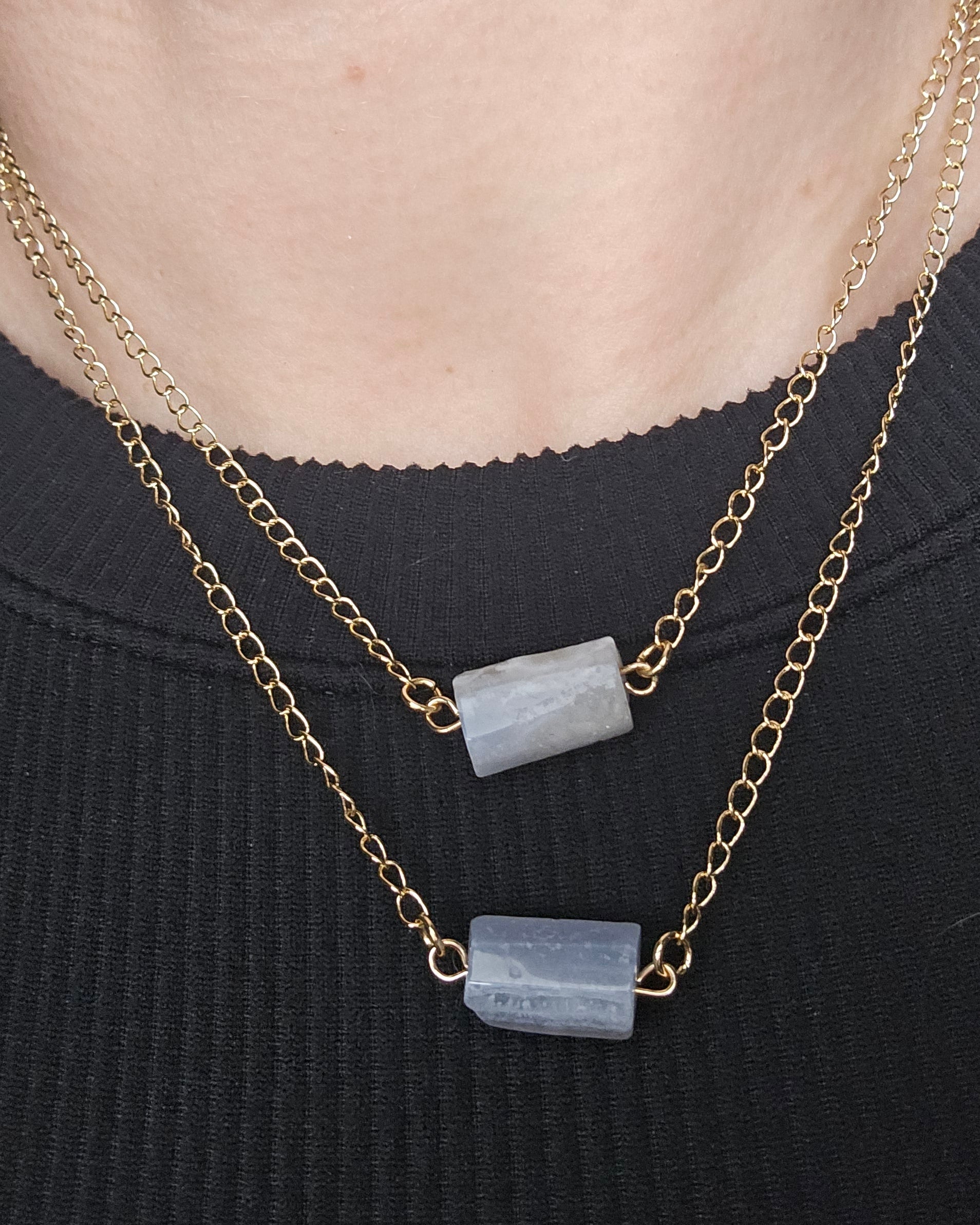 Close-up of the Blue Lace Agate double-chain necklace worn over a black top