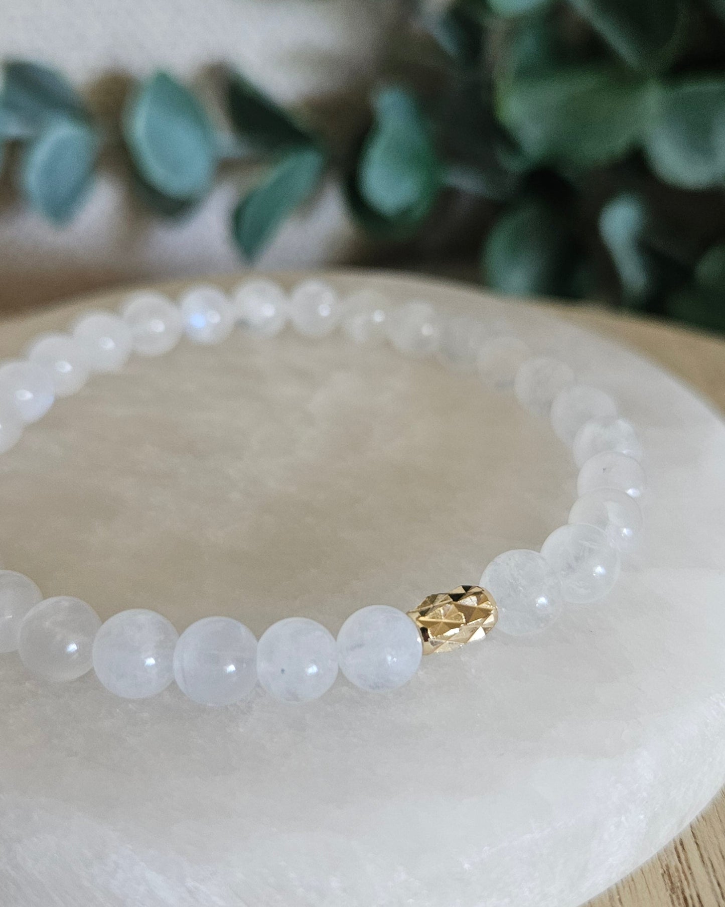 Close-up of the translucent Moonstone beads and diamond-cut gold-filled oval focal