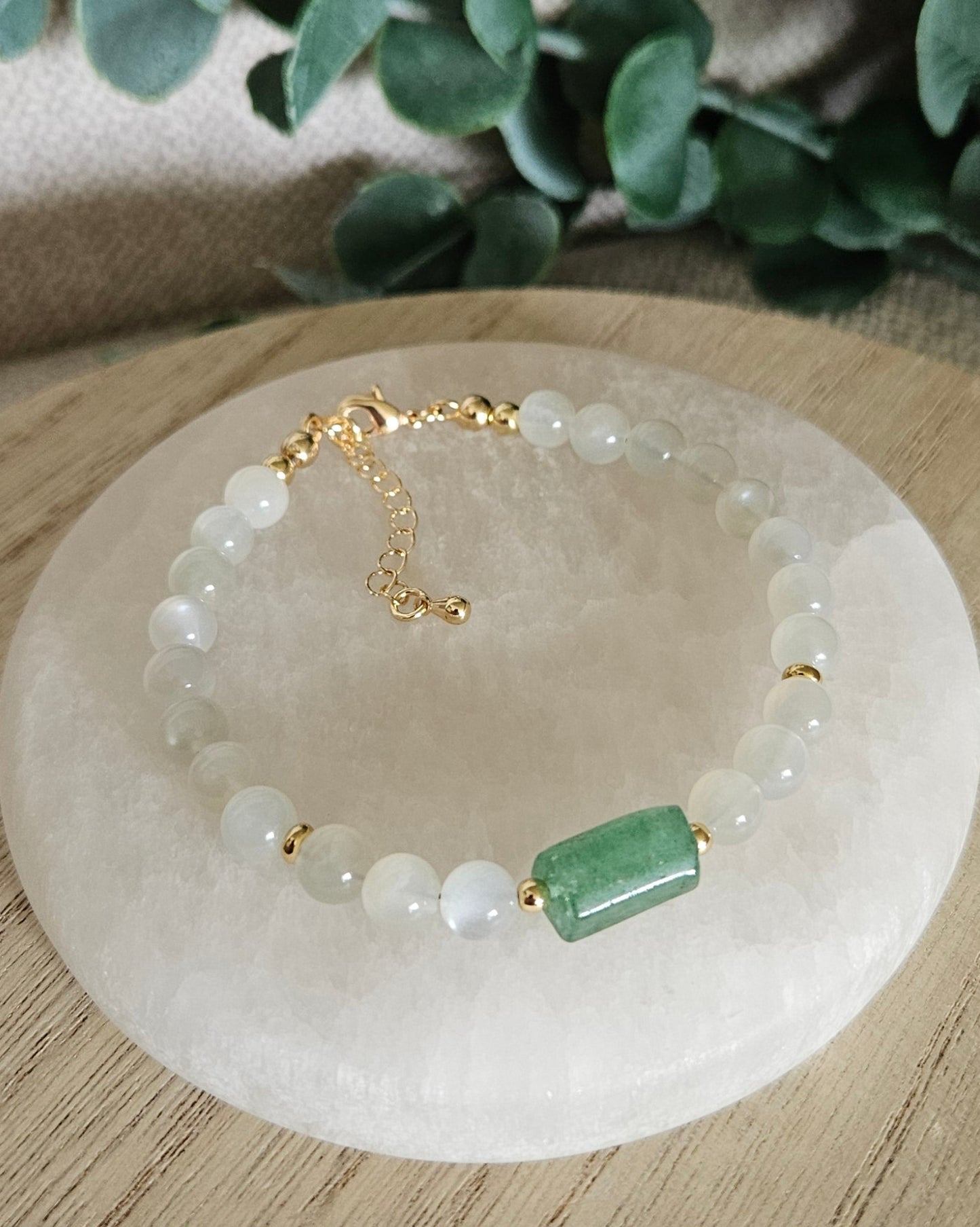 Overhead view of the White Moonstone and Green Strawberry Quartz bracelet with gold-filled clasp and extender chain