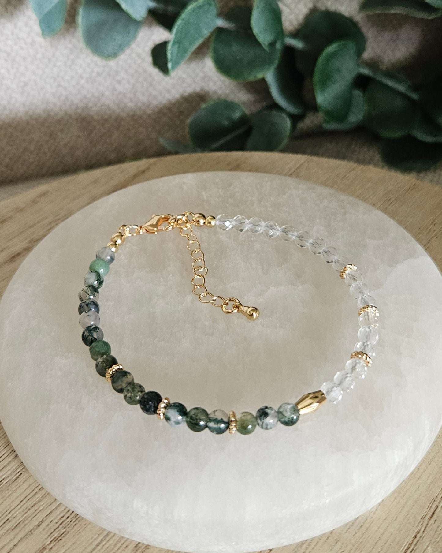 Overhead view of the half Moss Agate, half Clear Quartz bracelet with gold-filled clasp and extender chain