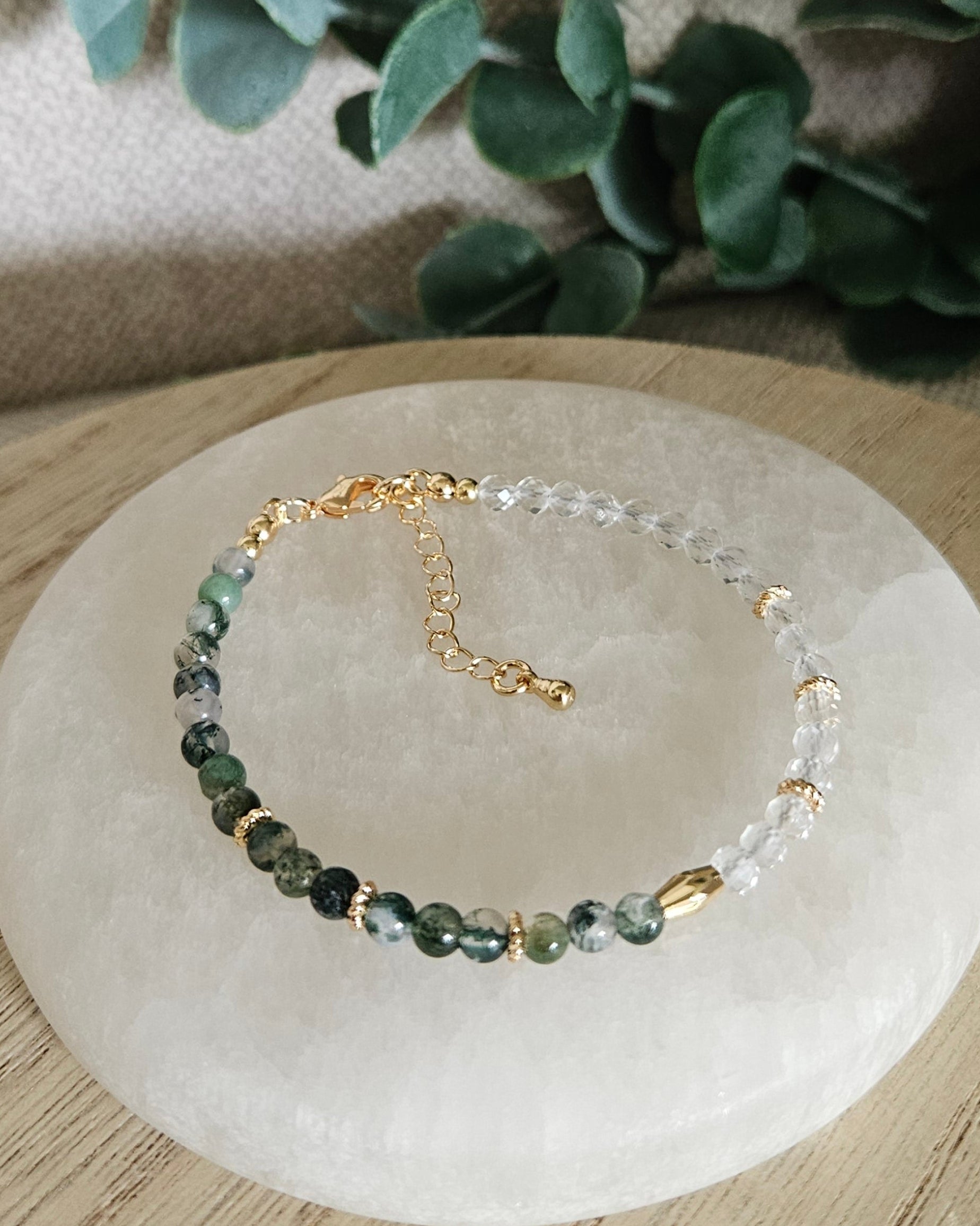 Overhead view of the half Moss Agate, half Clear Quartz bracelet with gold-filled clasp and extender chain