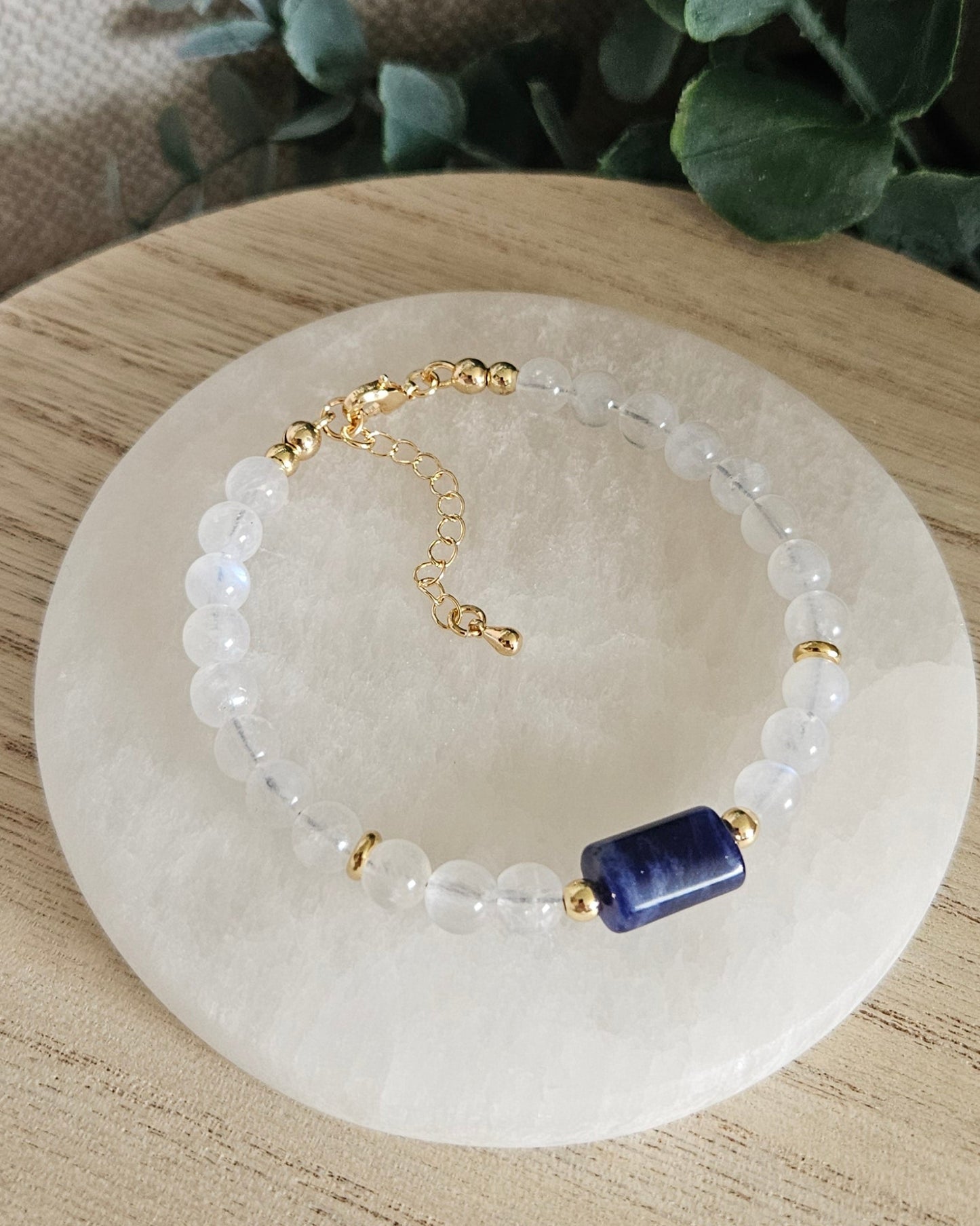 Overhead view of the Moonstone and Sodalite bracelet with gold clasp and extender chain