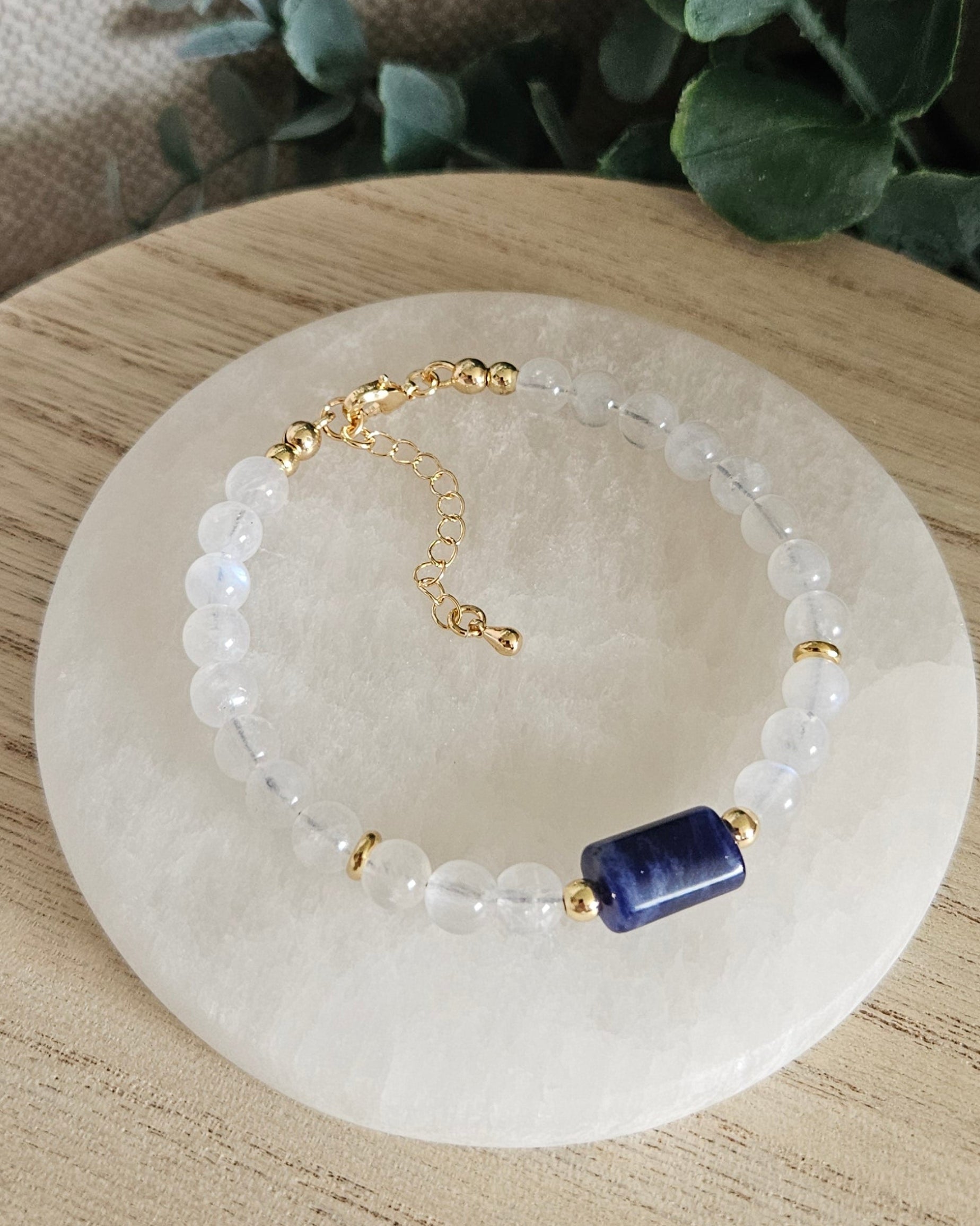 Overhead view of the Moonstone and Sodalite bracelet with gold clasp and extender chain