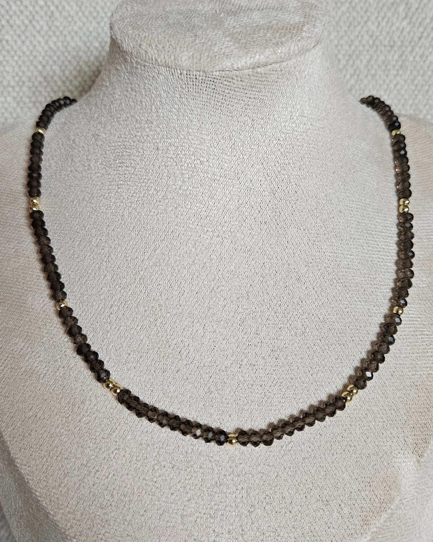 Smoky Quartz rondelle necklace displayed on a jewellery bust with the toggle clasp positioned at the back