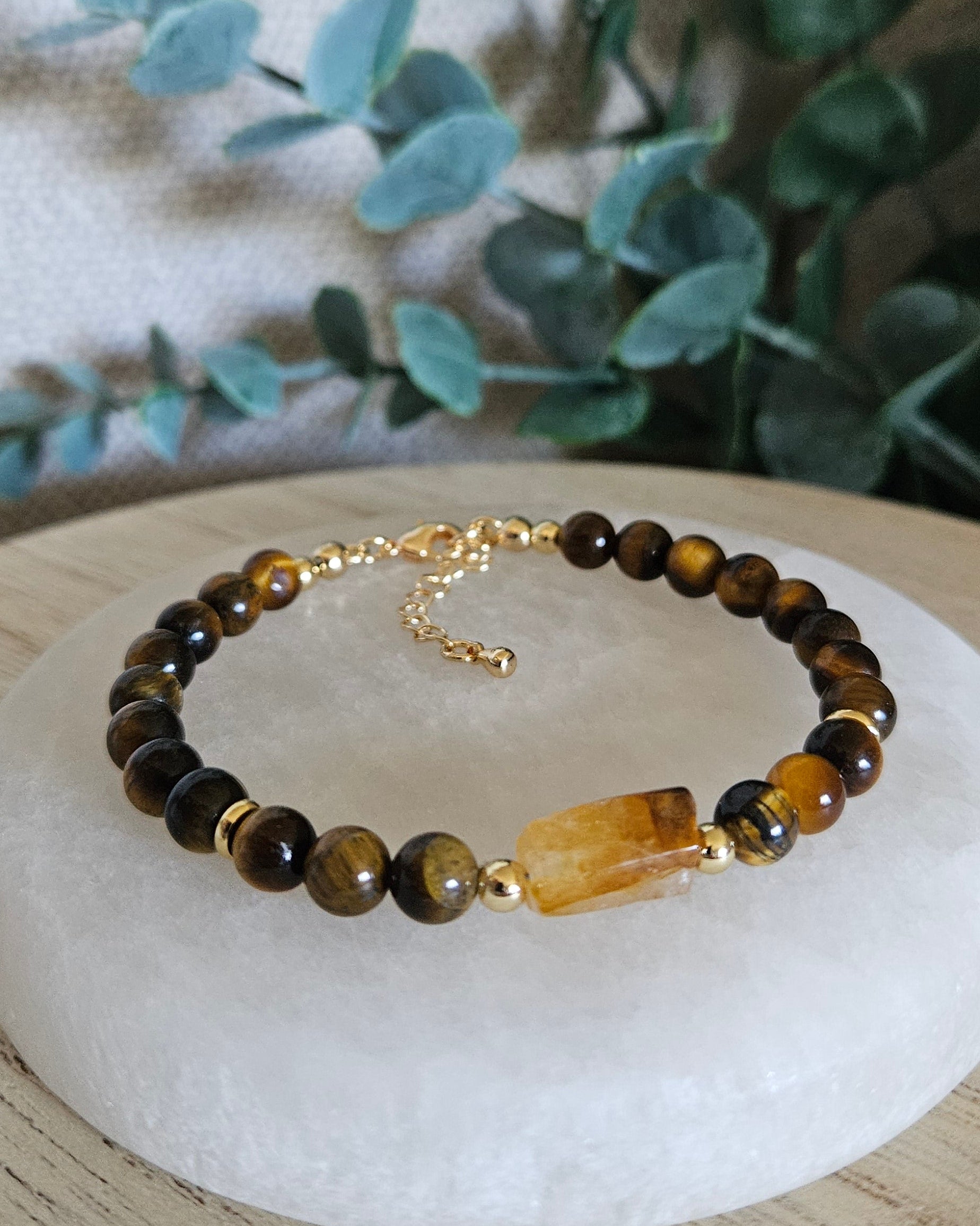 Tiger’s Eye bracelet with a rectangular Citrine focal, gold-plated accents and extender chain displayed on selenite