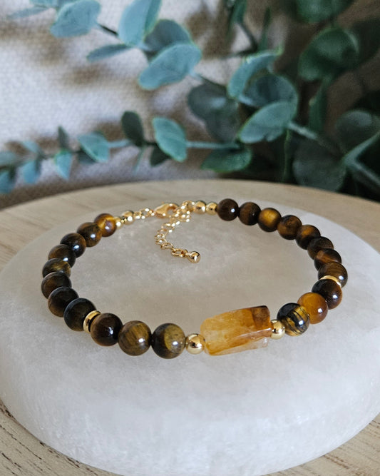 Tiger’s Eye bracelet with a rectangular Citrine focal, gold-plated accents and extender chain displayed on selenite