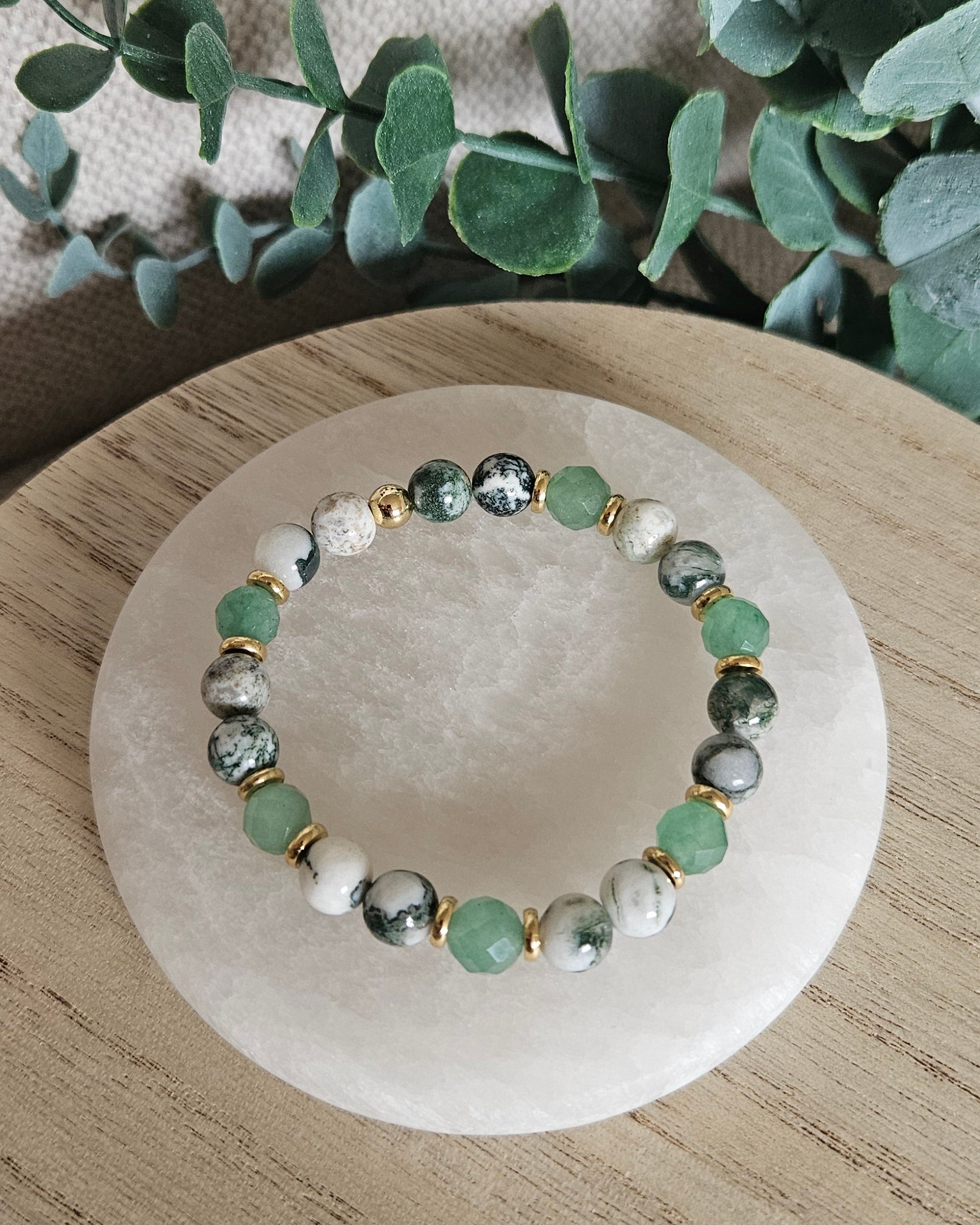 Detailed view of mottled Tree Agate and faceted Green Aventurine beads with gold-plated spacers