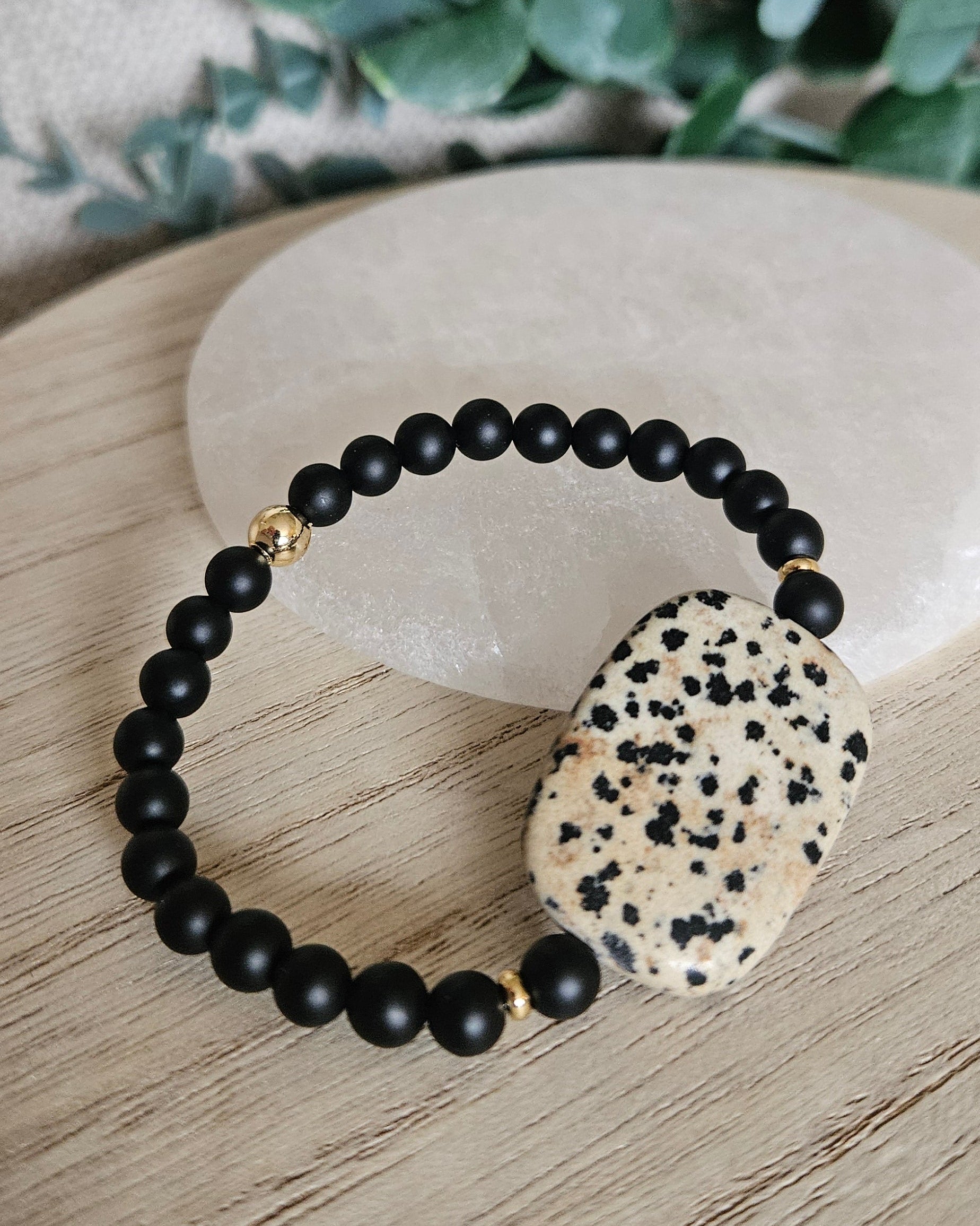 Alternate angled view showing the rounded rectangular Dalmatian Jasper focal and matte Black Onyx beads