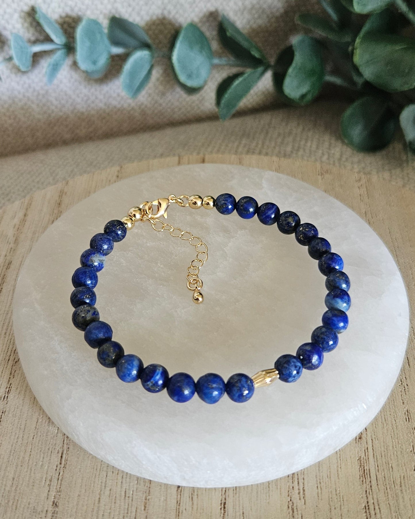 Overhead view of the Lapis Lazuli bracelet with gold-filled clasp, extender chain and oval focal accent