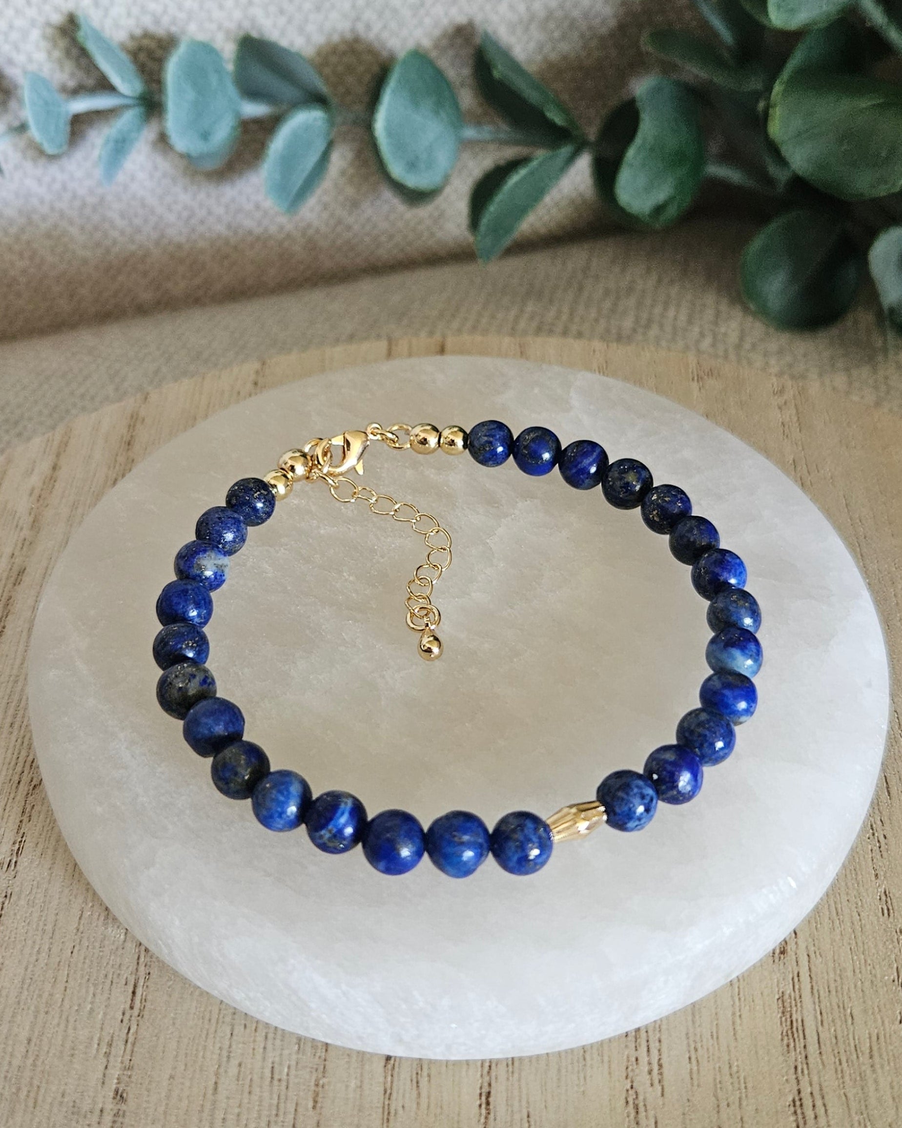Overhead view of the Lapis Lazuli bracelet with gold-filled clasp, extender chain and oval focal accent